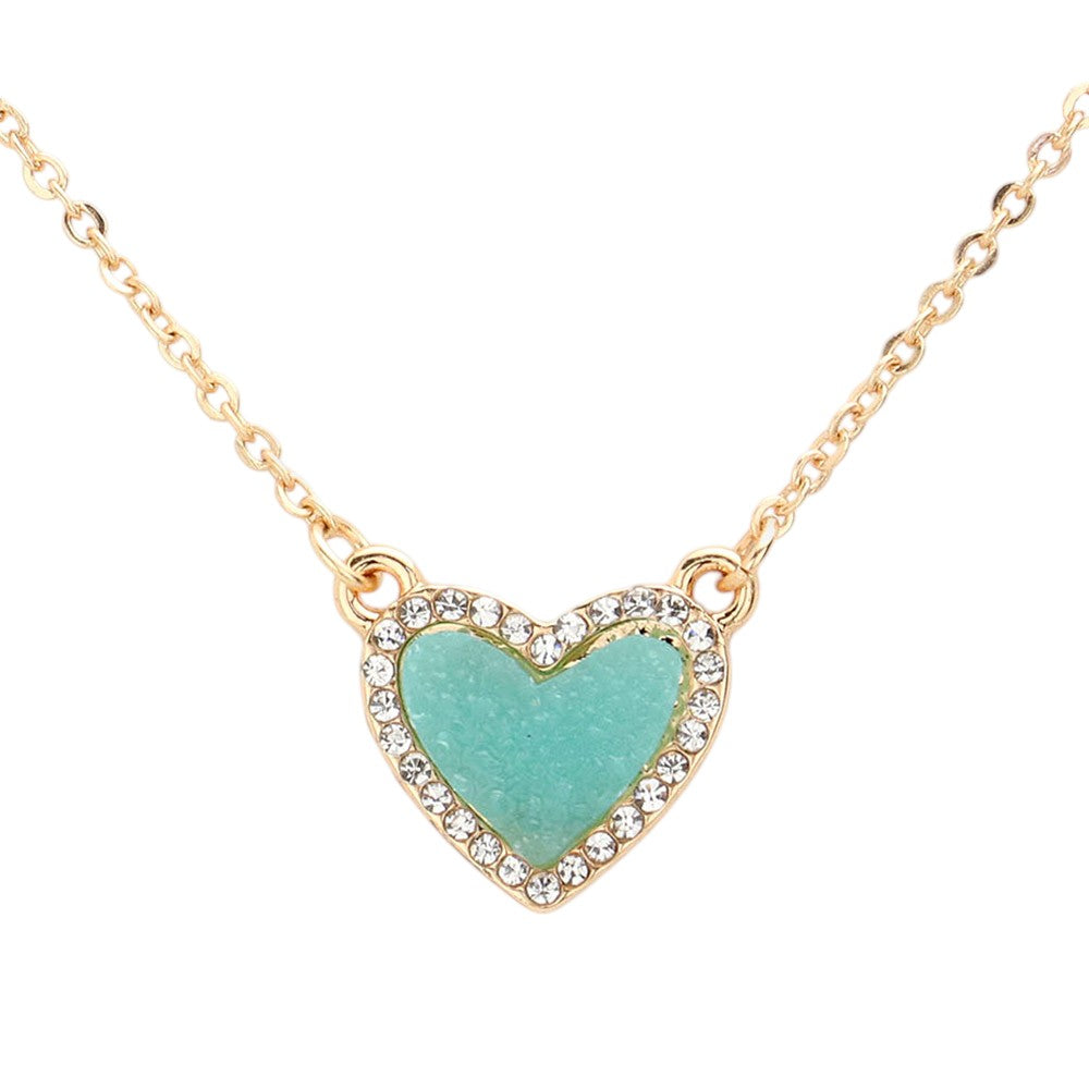 Aqua Rhinestone-Trimmed Druzy Heart Pendant Necklace adds sparkle and elegance to any outfit. The rhinestone trim enhances the natural beauty of the druzy heart pendant, creating a stunning and sophisticated look. Perfect for adding a touch of glamour to your wardrobe