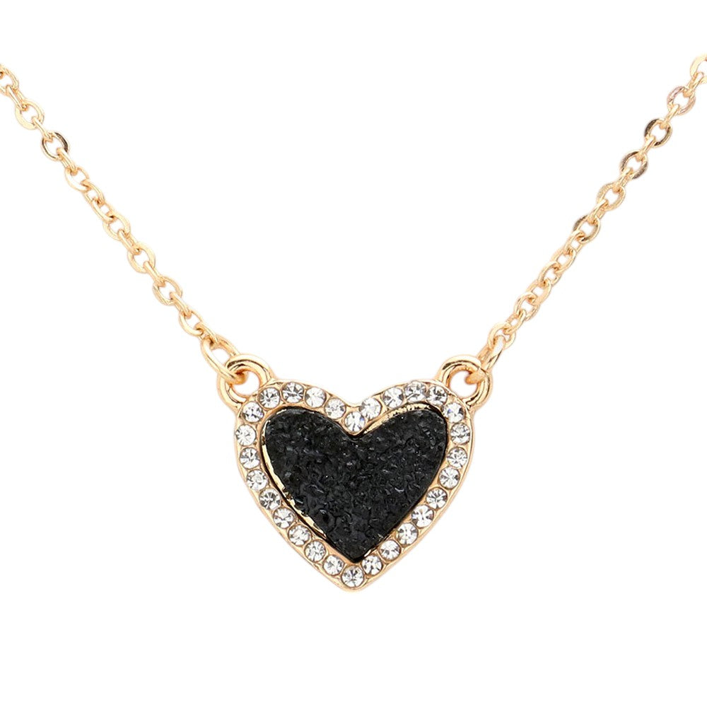 Black Rhinestone-Trimmed Druzy Heart Pendant Necklace adds sparkle and elegance to any outfit. The rhinestone trim enhances the natural beauty of the druzy heart pendant, creating a stunning and sophisticated look. Perfect for adding a touch of glamour to your wardrobe