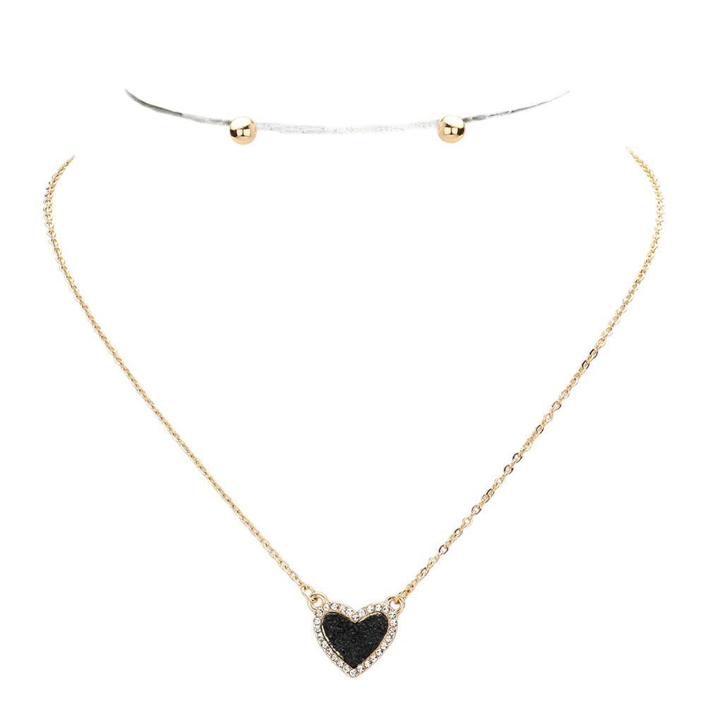 Black Rhinestone-Trimmed Druzy Heart Pendant Necklace adds sparkle and elegance to any outfit. The rhinestone trim enhances the natural beauty of the druzy heart pendant, creating a stunning and sophisticated look. Perfect for adding a touch of glamour to your wardrobe