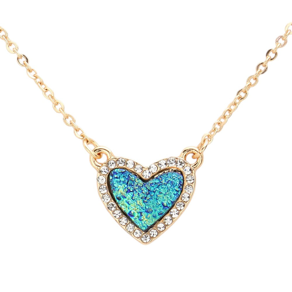 Blue Rhinestone-Trimmed Druzy Heart Pendant Necklace adds sparkle and elegance to any outfit. The rhinestone trim enhances the natural beauty of the druzy heart pendant, creating a stunning and sophisticated look. Perfect for adding a touch of glamour to your wardrobe