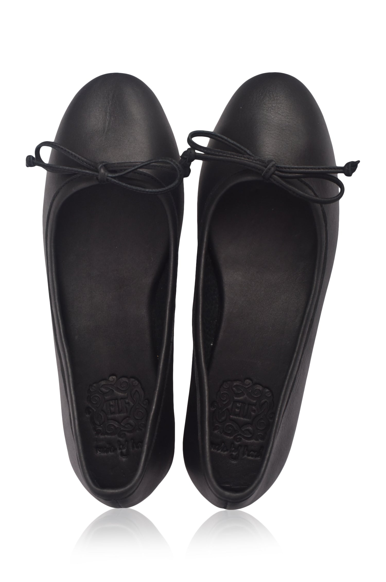 Pair of black flat shoes with bow details on a white background
