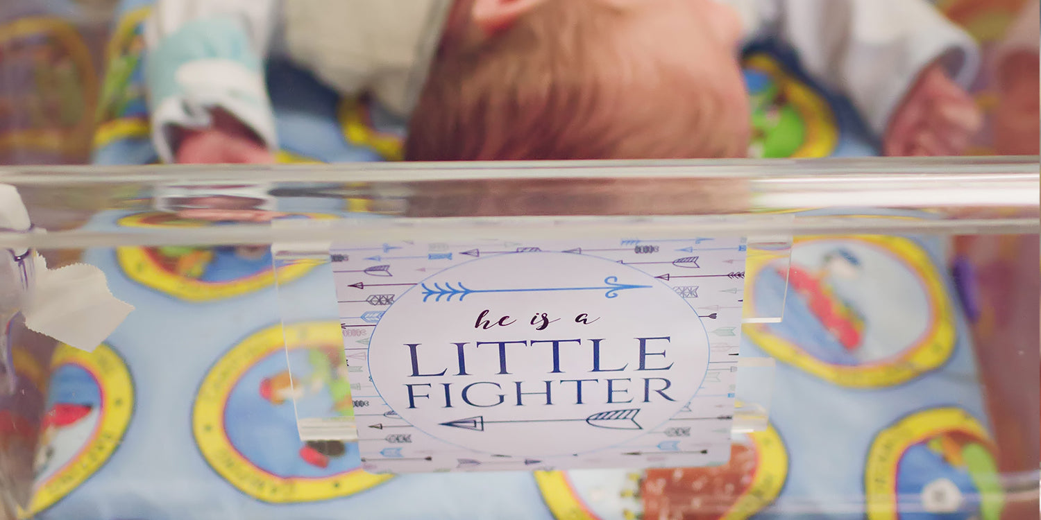 NICU Preemie baby boy fighting in the NICU unit. open isolette