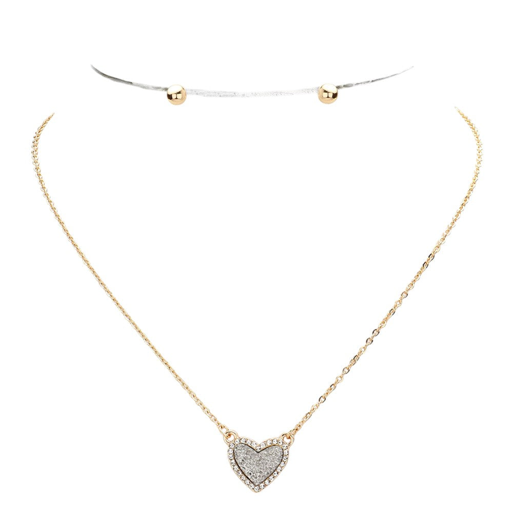 Hematite Rhinestone-Trimmed Druzy Heart Pendant Necklace adds sparkle and elegance to any outfit. The rhinestone trim enhances the natural beauty of the druzy heart pendant, creating a stunning and sophisticated look. Perfect for adding a touch of glamour to your wardrobe