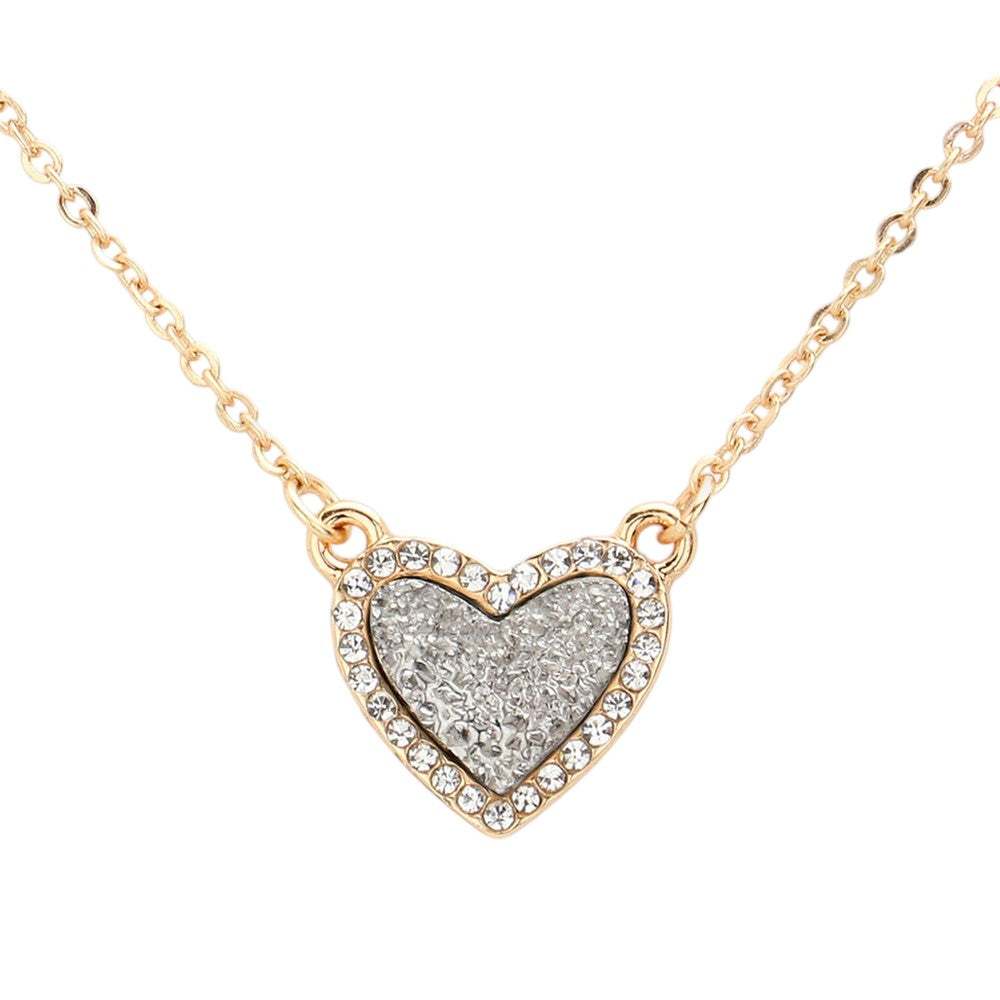 Hematite Rhinestone-Trimmed Druzy Heart Pendant Necklace adds sparkle and elegance to any outfit. The rhinestone trim enhances the natural beauty of the druzy heart pendant, creating a stunning and sophisticated look. Perfect for adding a touch of glamour to your wardrobe