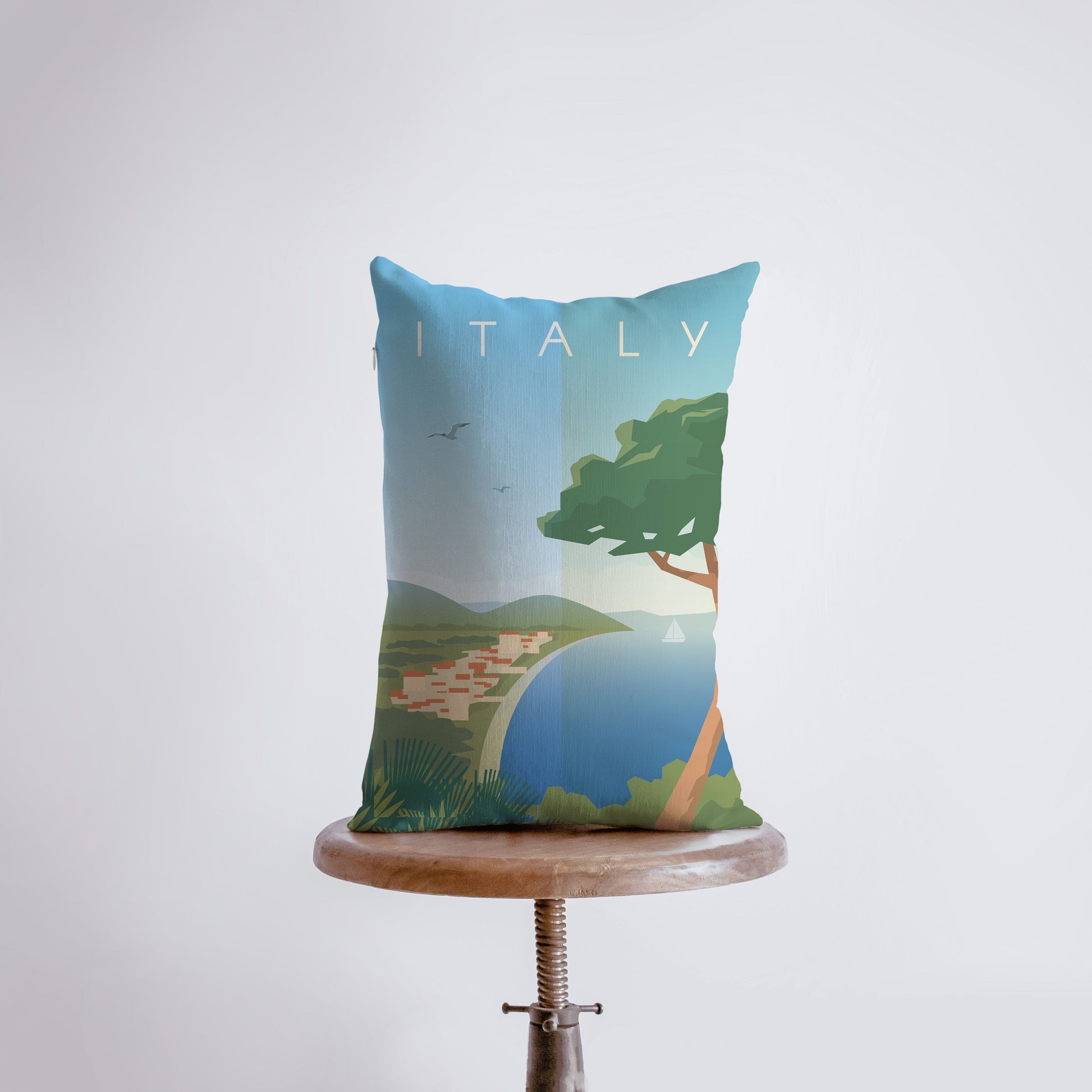 a pillow sitting on top of a wooden table