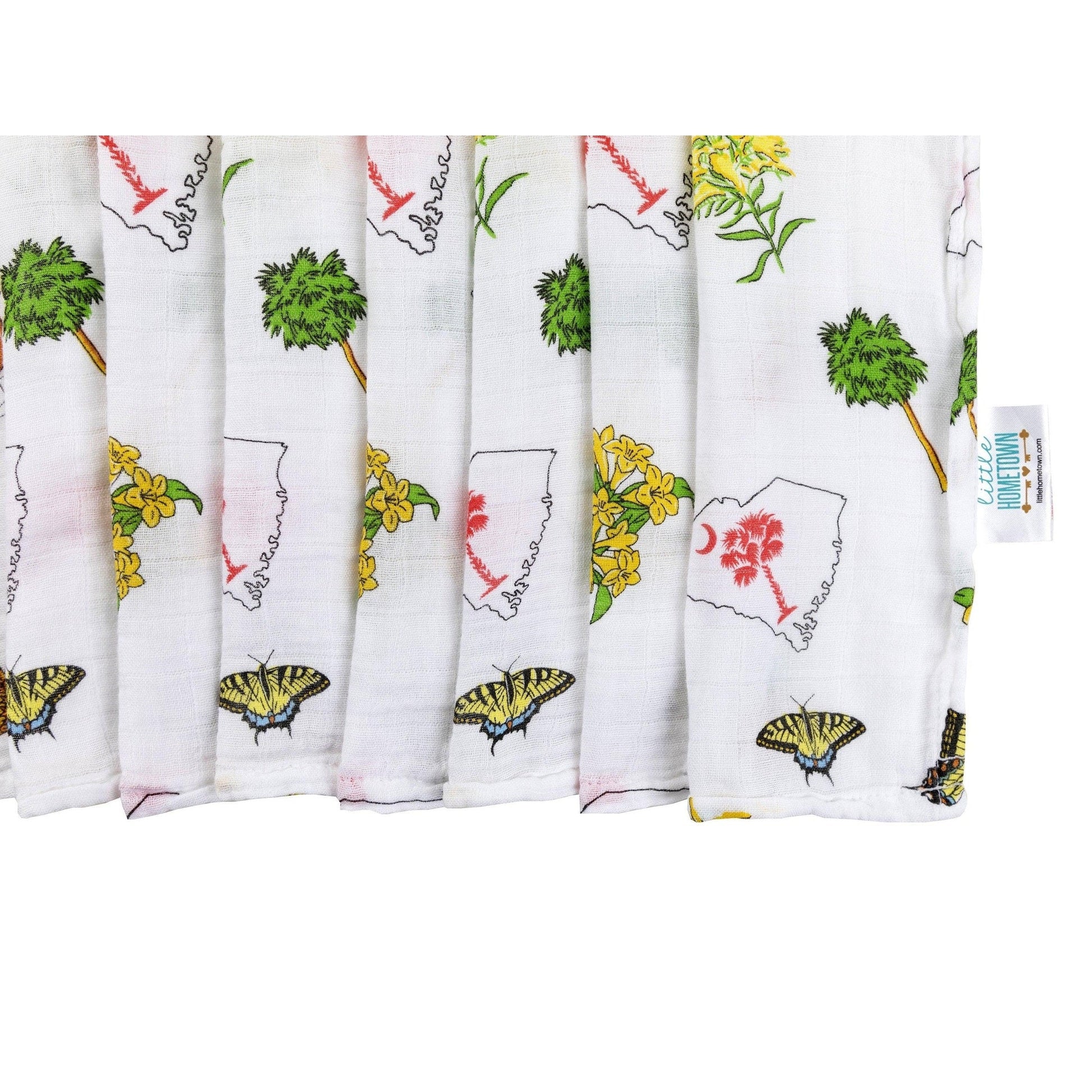 South Carolina-themed baby gift set with muslin swaddle blanket and burp cloth/bib combo, featuring state icons.