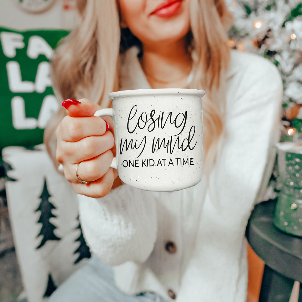 coffee mug for mom who needs five minutes alone
large ceramic mug for mom’s daily caffeine
lifestyle shot of funny motherhood coffee mug
mug for mom with loud wild kids
relatable mom quote mug for everyday use
funny mug for mom who lives in carline
motherhood survival coffee mug with script text
ceramic mug for moms who are always multitasking